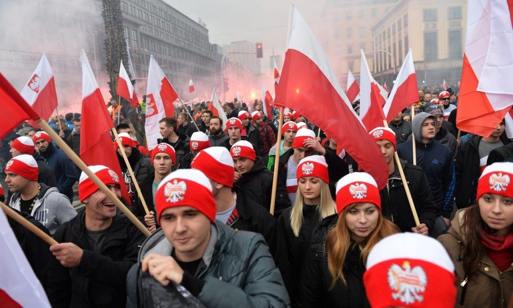 Polish Christian-nationalists marching in protest against immigrants and refugees